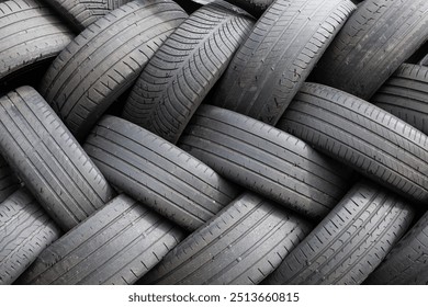Background of Stack of used car tires waiting to be recycled
