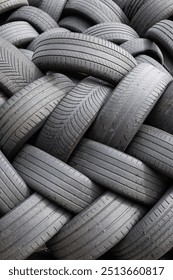 Background of Stack of used car tires waiting to be recycled
