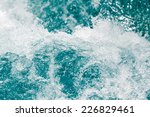 background of stormy water with splashes