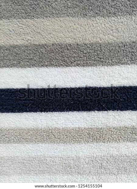 grey and white striped towels