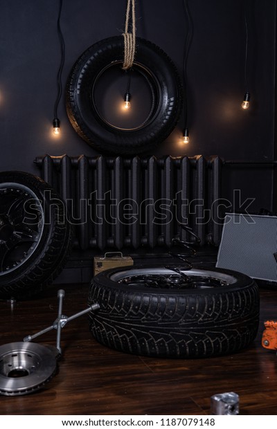 background in\
the style of tire shop with car\
wheels