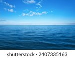 background for summer vacation concept. Nature of the beach and sea, summer with sunlight, sandy beach The sparkling sea water contrasts with the blue sky 