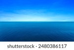 background for summer vacation concept. Nature of the beach and sea, summer with sunlight, sandy beach The sparkling sea water contrasts with the blue sky 