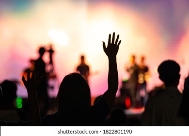 Background of Sunday service in church: Blurred silhouette woman raised hand to worship God - Shutterstock ID 1822801190