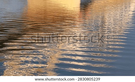 background of surface of Danube River with reflected sunlight and nightlights