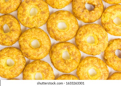 Background Of Sweet And Salty Snack - Corn Puff Donuts With Peanuts And Caramel