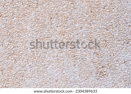 Background or texture Abstract  Natural pattern of pebbles small or gravel color yellow, orange attached with beautiful cement concrete. used to make wallpaper website along walls of houses, building	
