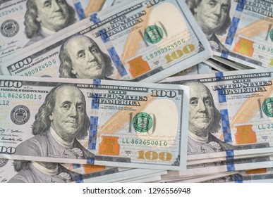 Background Texture Of American 100 Dollar Bills In An Overhead Flat Lay Full Frame View