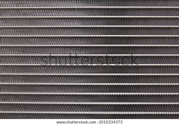 Background texture of\
an automotive\
radiator