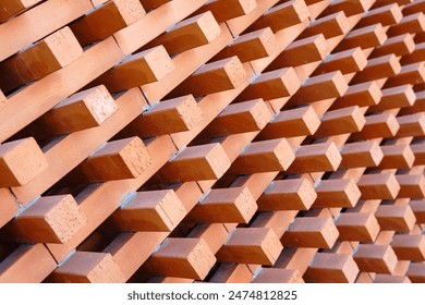 Background and Texture of Brick blocks or Red terracotta bricks. Beautifully arranged together with sunlight hitting them, creating an image dimension for the exterior building is modern architecture.
