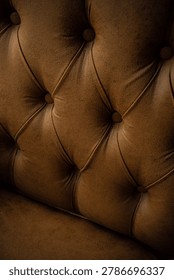 Background texture of a buttoned sofa backrest.