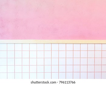 Background texture of cement wall with soft pink paint wall and white mosaic wall tiles.
