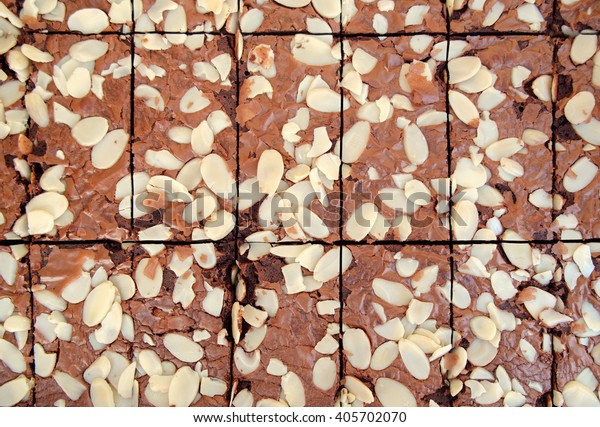 Background\
texture of chocolate cake with nut. Top\
view.