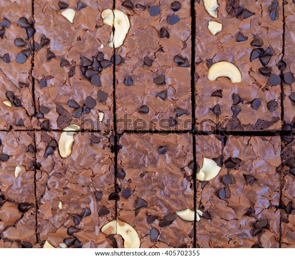 Background\
texture of chocolate cake with nut. Top\
view.