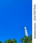 The background and texture of the clean blue sky, decorated with white mosque tower domes and green trees