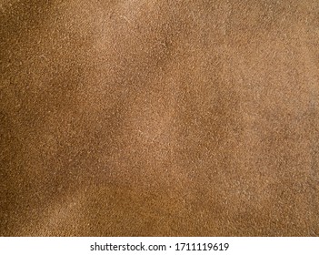 Background Texture Of A Cognac Brown Suede Leather Material Surface