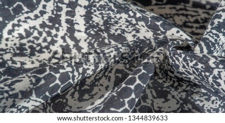 Background texture. cotton women scarf black and white pattern on one side of the scarf and color paisley pattern on the other side
