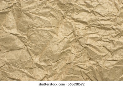 Background texture of crumpled waste paper cardboard. kraft paper - Shutterstock ID 568638592