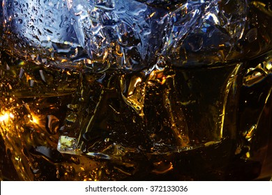 Background Texture, Detail Of A Whiskey Glass With Ice Cubes, Close Up Shot With With Selected Focus And Narrow Depth Of Field