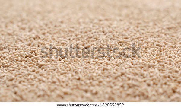 Background,\
texture from dry granular yeast, top view. Active dry yeast, top\
view. Heap of dry yeast granules, texture. Dry yeast is used in\
baked goods. Background for use on the\
label.