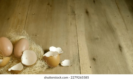 Background texture of egg and egg shells on the wooden background, design for card, invitation easter theme