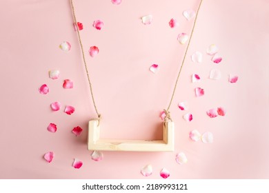 background texture empty space for baby. children's swing for a photo shoot of newborns. photo props. the bed is decorated with flowers. furniture for dolls and flying rose petals - Shutterstock ID 2189993121