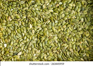 Textura de fondo de semillas de calabaza fresca verde descascarillado semillas de calabaza un popular tentempié e ingrediente de ensalada rico en proteínas y nutrientes