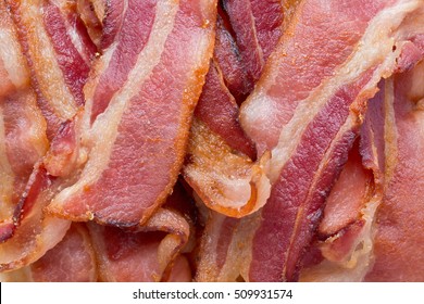 Background Texture Of Fried Bacon Strips.