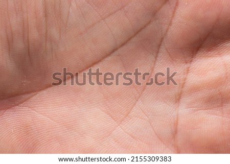 Background texture of human skin tan abstract close-up of hands.