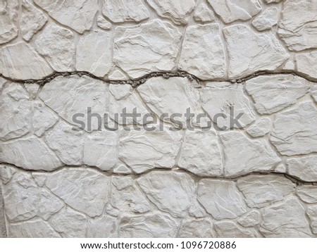 Background texture of old gray concrete fence with square pattern. Geometric pattern