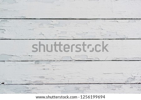 Background texture: old wooden boards painted with white paint, which over time rubbed.