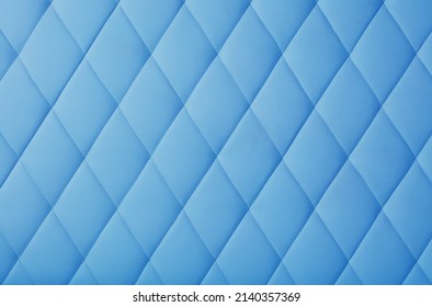 Background Texture Of Pastel Blue Genuine Leather Soft Tufted Furniture Or Wall Panel Upholstery With Deep Diamond Pattern, Close Up