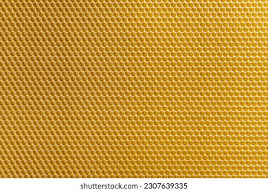 Background texture and pattern of section voshchina of wax honeycomb from a bee hive for filled with honey. Voshchina an artificial basis for the construction of honeycombs, sheet of wax of the cells
