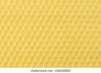 Background texture and pattern of a section of wax honeycomb from a bee hive filled with golden honey in a full frame view - Shutterstock ID 2181432823