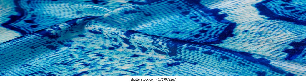 Background, texture, pattern, silk-white fabric with a pattern of blue squares of lines