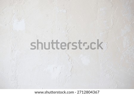background texture of a raw, irregular, rustic, white cement wal