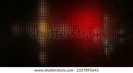 Background texture of red light and yellow light on glass window with square pattern, abstract background, design for backdrop or invitation card.