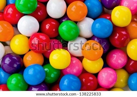background texture of several colored gumballs.