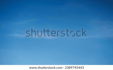 A background texture showing a blue sky with very subtle dreamy white clouds.                     
