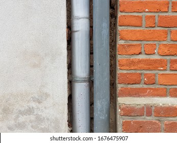 background texture stone wall of bricks and a gutter
