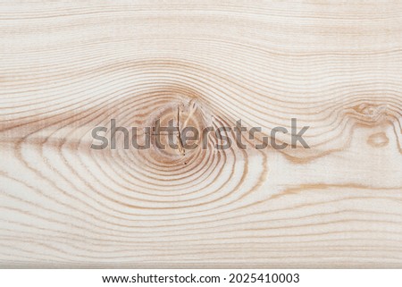 Background texture. Surface of a larch edged board with knot on cut. Wood texture. Top view, copy space.