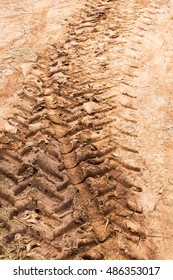 Background texture tire tracks in the mud on the road, motorcycle, agricultural and dry soil.