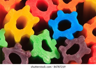 Background Texture Of Vertical Ends Of Rainbow Colored Licorice Sticks.