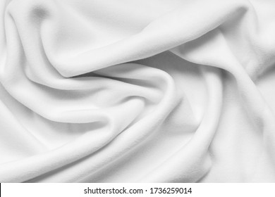 Background texture of white fleece, soft napped insulating fabric made of polyester