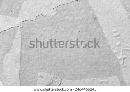 Background texture of white paper mache surface, a composite material consisting of paper pieces reinforced with textiles, and bound with an adhesive, such as glue, starch, or wallpaper paste