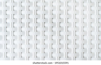 background from the texture of wicker white plastic