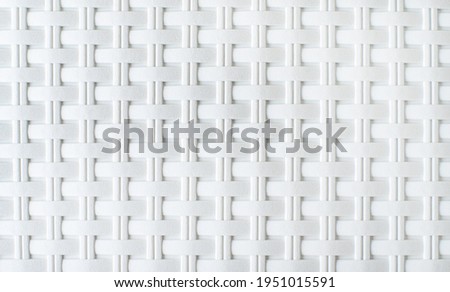 background from the texture of wicker white plastic