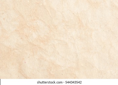 Background of textured paper with spots and folds