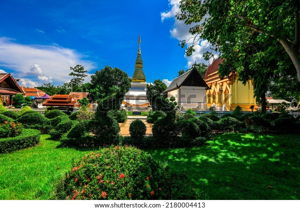 The background of\
Thailand\'s major religious sites in Khon Kaen, with ancient pagodas\
and beautiful churches for future generations to study history\
(Phra That Kham Kaen)