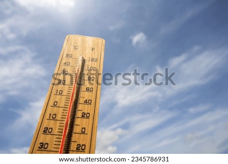 The background thermometer is a blue sky. global warming content